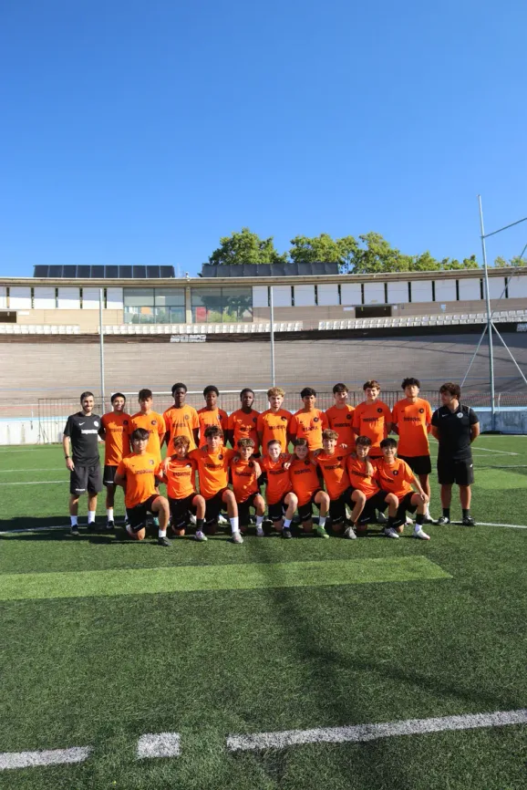 Impactus Football Academy coaching staff and players in Barcelona